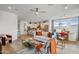 Bright, open-concept living room with a modern kitchen and dining area, perfect for entertaining at 19426 W San Juan Ave, Litchfield Park, AZ 85340