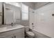 Bright bathroom featuring a shower-tub combo, single sink vanity, and modern fixtures at 20073 S 231St Pl, Queen Creek, AZ 85142