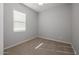 An empty bedroom with neutral walls, a ceiling fan and carpeted floors at 20073 S 231St Pl, Queen Creek, AZ 85142