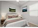 Staged bedroom showcasing calming tones, natural light, and plush bedding at 20073 S 231St Pl, Queen Creek, AZ 85142