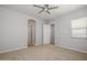 Spacious bedroom with a ceiling fan, closet access, and natural light at 20073 S 231St Pl, Queen Creek, AZ 85142