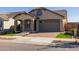 Single Gathering home with a manicured lawn and neutral exterior paint, featuring a 2 car garage at 20073 S 231St Pl, Queen Creek, AZ 85142