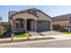 Single Gathering house with a manicured front yard and a two car garage at 20073 S 231St Pl, Queen Creek, AZ 85142