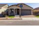 Charming single Gathering home featuring manicured front yard and neutral exterior paint at 20073 S 231St Pl, Queen Creek, AZ 85142