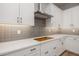 Close-up of the modern kitchen with custom cabinets and stylish backsplash at 20073 S 231St Pl, Queen Creek, AZ 85142