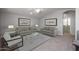 Cozy living room with a neutral color palette, comfortable seating, and natural light at 20073 S 231St Pl, Queen Creek, AZ 85142