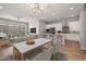 Bright, open-concept living and dining area with modern decor and sleek kitchen at 20073 S 231St Pl, Queen Creek, AZ 85142