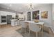 Spacious and bright living room with an open layout and modern kitchen at 20073 S 231St Pl, Queen Creek, AZ 85142