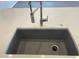 Close up of a stainless steel sink with modern faucet and gray basin at 20073 S 231St Pl, Queen Creek, AZ 85142