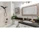 Bathroom vanity with stone countertop, neutral finishes, and modern fixtures at 20100 N 78Th Pl # 1048, Scottsdale, AZ 85255