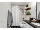 Well-lit bathroom features a dark countertop and modern fixtures at 20100 N 78Th Pl # 1048, Scottsdale, AZ 85255