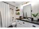 Bathroom featuring a white vanity with black countertops at 20100 N 78Th Pl # 1048, Scottsdale, AZ 85255