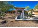 Inviting clubhouse entrance featuring a stone facade and a tranquil water fountain feature at 20100 N 78Th Pl # 1048, Scottsdale, AZ 85255