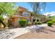 Well-maintained exterior view of a multi-story building with lush landscaping and a paved walkway at 20100 N 78Th Pl # 1048, Scottsdale, AZ 85255
