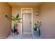 Stylish front entrance with decorative plants adding a welcoming touch to the home's exterior at 20100 N 78Th Pl # 1048, Scottsdale, AZ 85255