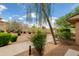 Beautifully landscaped grounds with a walking path and mature trees create a serene outdoor environment at 20100 N 78Th Pl # 1048, Scottsdale, AZ 85255