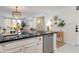 Open-concept kitchen with breakfast bar overlooking the brightly lit living area at 20100 N 78Th Pl # 1048, Scottsdale, AZ 85255