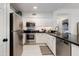 Updated kitchen featuring modern stainless steel appliances and sleek, dark countertops at 20100 N 78Th Pl # 1048, Scottsdale, AZ 85255