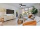 Living room showcasing stylish media console, comfortable seating, and natural light at 20100 N 78Th Pl # 1048, Scottsdale, AZ 85255
