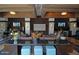 An elegant lounge area featuring comfortable seating, modern lighting, and multiple large screen televisions at 20100 N 78Th Pl # 1048, Scottsdale, AZ 85255