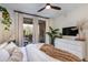 Comfortable main bedroom with balcony, bright natural light, and modern furniture at 20100 N 78Th Pl # 1048, Scottsdale, AZ 85255