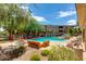 Inviting community pool area with plenty of lounge chairs and lush landscaping for relaxation at 20100 N 78Th Pl # 1048, Scottsdale, AZ 85255