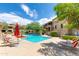 Relaxing pool area with comfortable lounge chairs and umbrellas offering shade on a sunny day at 20100 N 78Th Pl # 1048, Scottsdale, AZ 85255