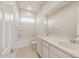 Bright bathroom featuring double sinks, a large mirror, and a shower/tub combination for convenience at 24791 N 169Th Dr, Surprise, AZ 85387