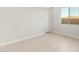 Tiled bedroom with a bright window and a convenient entryway enhances the living experience at 24791 N 169Th Dr, Surprise, AZ 85387