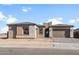 Charming single-story home with a neutral color palette, well-maintained landscaping, and a two-car garage at 24791 N 169Th Dr, Surprise, AZ 85387