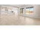 Bright, open-concept living area featuring tile flooring and windows at 24791 N 169Th Dr, Surprise, AZ 85387
