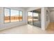 Sunlit room with sliding glass doors leading to the backyard at 24791 N 169Th Dr, Surprise, AZ 85387