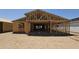 Exterior view shows the home's structural framework and modern design at 32101 N Lone Rancher Way, San Tan Valley, AZ 85140