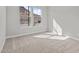 Bright, carpeted bedroom with base molding and natural light at 32541 N 135Th Dr, Peoria, AZ 85383