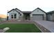 Charming single-story home with well-manicured lawn and stone accents at 32541 N 135Th Dr, Peoria, AZ 85383