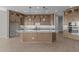 Gourmet kitchen with granite countertops, stainless steel appliances, and custom cabinets at 32541 N 135Th Dr, Peoria, AZ 85383