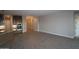 Bright and spacious living room with tile flooring and a view of the kitchen at 32541 N 135Th Dr, Peoria, AZ 85383