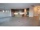 Open-concept living room with tile flooring, recessed lighting, and a modern kitchen at 32541 N 135Th Dr, Peoria, AZ 85383