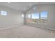 Spacious primary bedroom with large windows offering stunning views and plush carpeting at 32541 N 135Th Dr, Peoria, AZ 85383