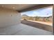View of patio with mountain in background and American flag in the distance at 32541 N 135Th Dr, Peoria, AZ 85383