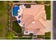 Aerial view of a home with a swimming pool, patio, and lush landscaping, offering a serene outdoor oasis at 3665 S Jojoba Way, Chandler, AZ 85248