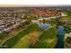 Picturesque aerial shot showcasing a residential area nestled amidst a beautiful golf course landscape at 3665 S Jojoba Way, Chandler, AZ 85248