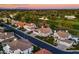 Aerial view of a residential neighborhood near a golf course and bodies of water in a suburban setting at 3665 S Jojoba Way, Chandler, AZ 85248
