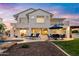 A spacious backyard with a swimming pool, lounge chairs, patio seating, and a manicured lawn at 3665 S Jojoba Way, Chandler, AZ 85248