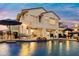 A stunning backyard with a pool, bar seating and an outdoor fireplace, perfect for relaxation and entertainment at 3665 S Jojoba Way, Chandler, AZ 85248