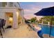 Spacious backyard with pool, patio, and golf course views, offering the perfect blend of relaxation and entertainment at 3665 S Jojoba Way, Chandler, AZ 85248