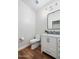 Bathroom featuring wood-look floors, white vanity, and a modern toilet at 3665 S Jojoba Way, Chandler, AZ 85248