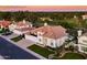Charming two-story home with a well-manicured lawn and professional landscaping with a view of the golf course at 3665 S Jojoba Way, Chandler, AZ 85248