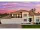 Charming two-story home with a well-manicured lawn, professional landscaping, and a three-car garage at 3665 S Jojoba Way, Chandler, AZ 85248