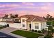 Elegant home with manicured landscaping, a spacious three-car garage, and classic architectural details at 3665 S Jojoba Way, Chandler, AZ 85248